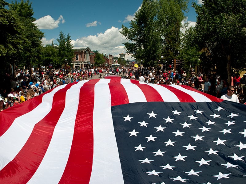 big american flag during the parade