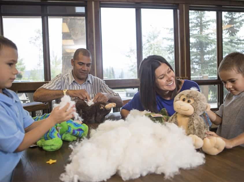 Family making stuffed animals