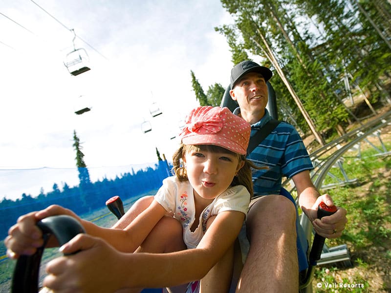 dad and daughter on the alpine slide